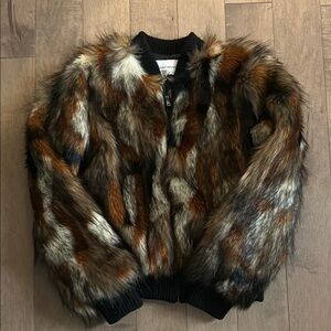 Luxurious Multi-Toned Fur Jacket with Plush Texture and Vintage Style